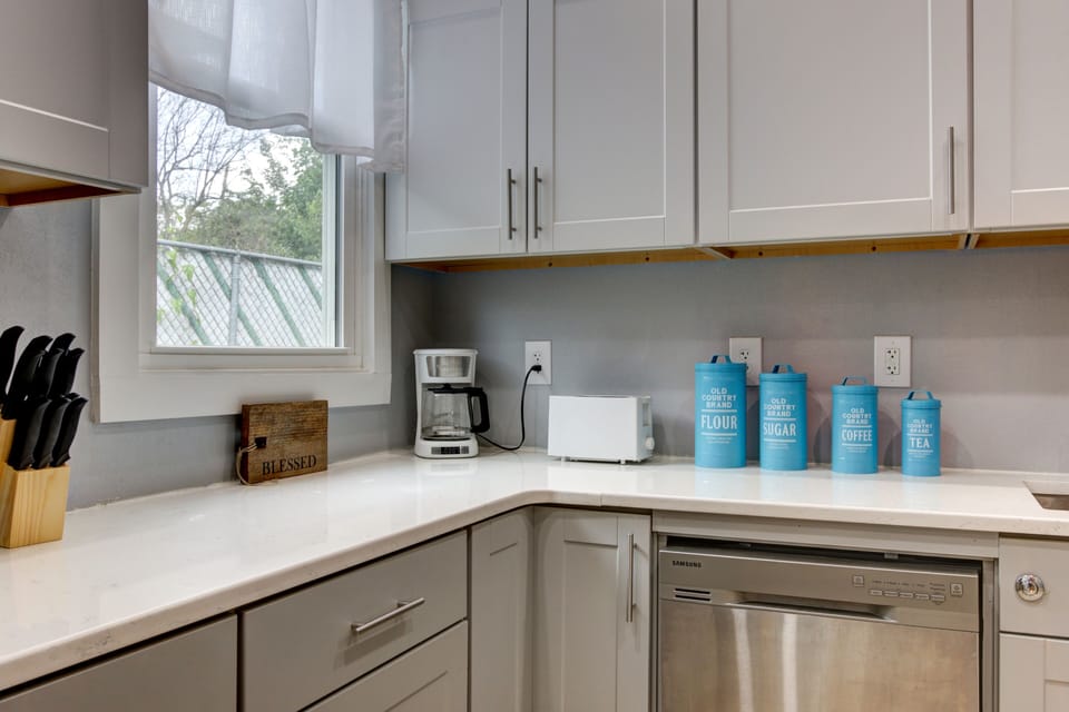 Fully stocked kitchen, with Gas stove, dishwasher, and large fridge.