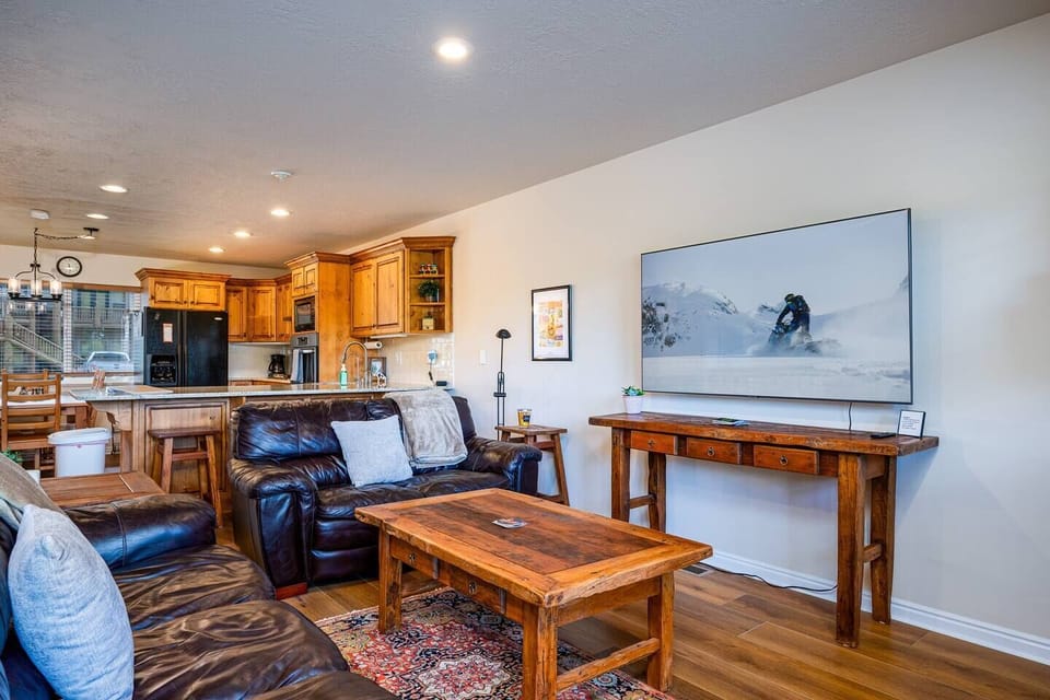 The open-concept living space, complete with a dining area, facilitates effortless conversation with family and friends.