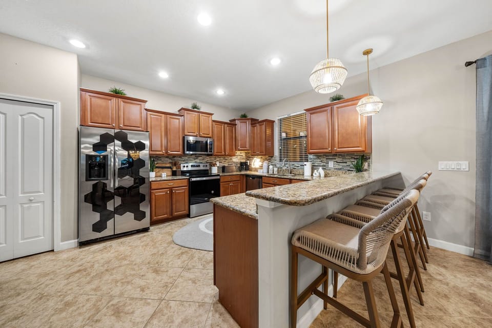 Kitchen counter with four comfortable bar stools
