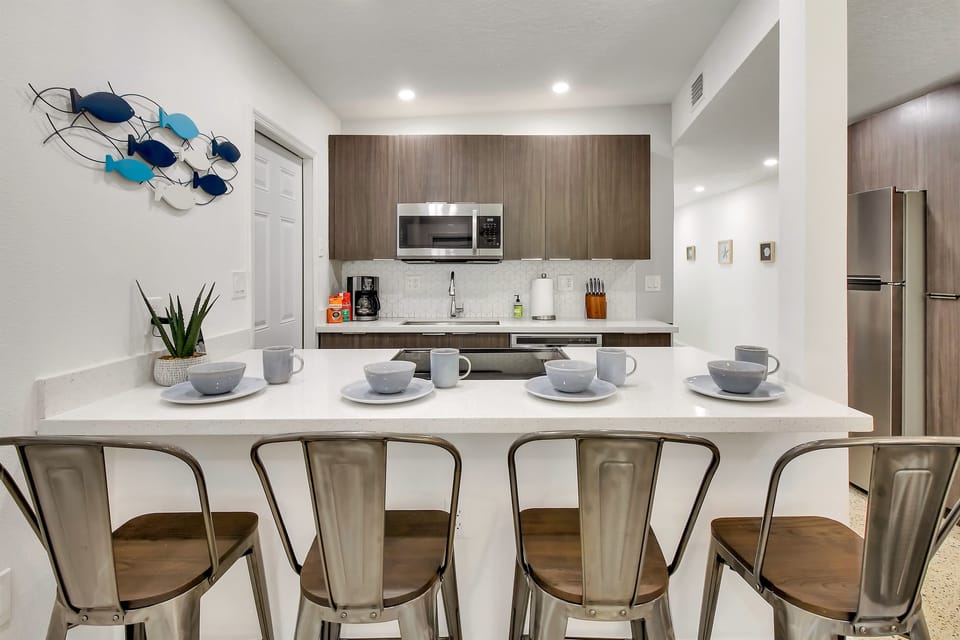 Kitchen is well stocked with all the pots, pans, utensils, dishes you need for cooking and baking as well as common staples and coffee