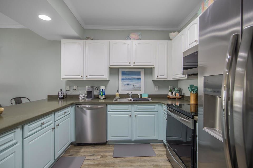 Kitchen has stainless steel appliances.