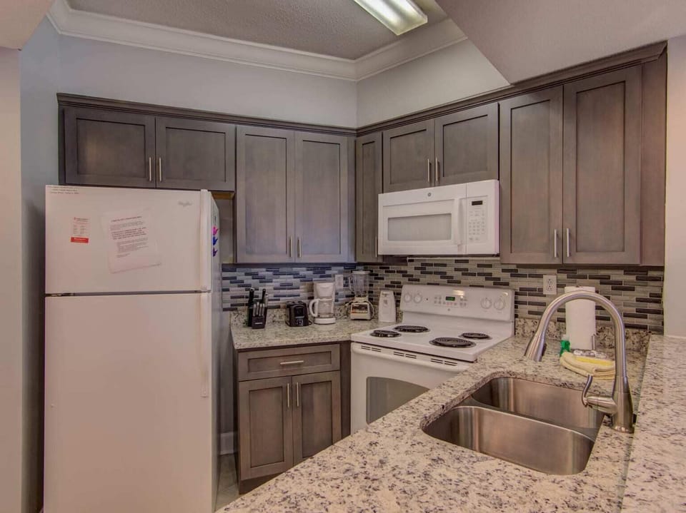 Stylish well-equipped kitchen with pots/pans/utensils for your stay.