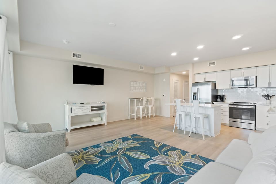Open concept living area with kitchen.