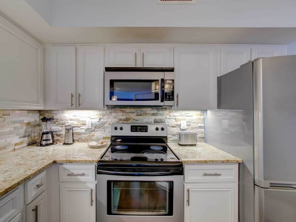 Beautiful kitchen with stainless steel appliances.