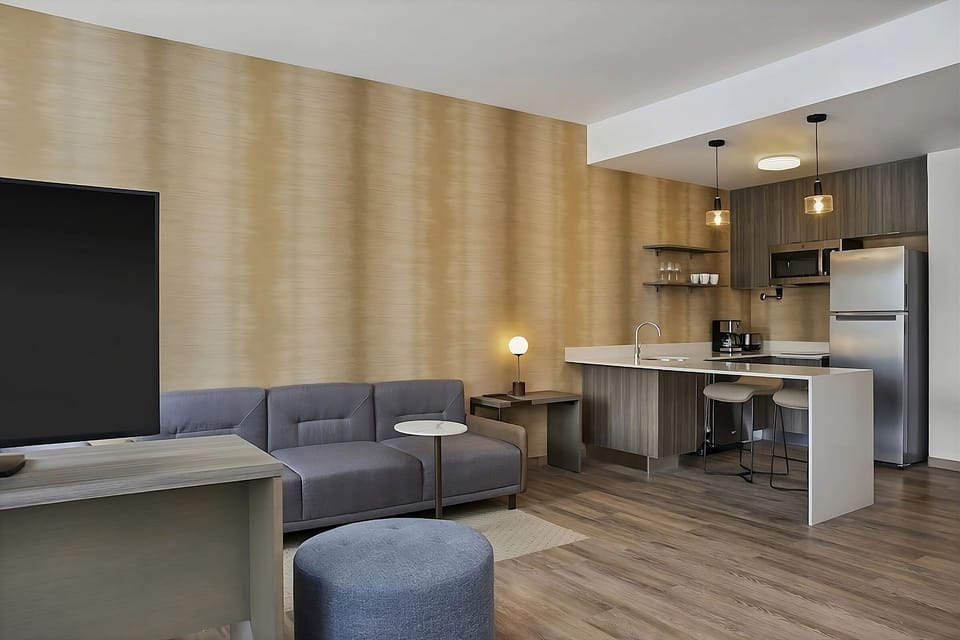 Kick back in the cozy lounge beside the modern kitchenette
