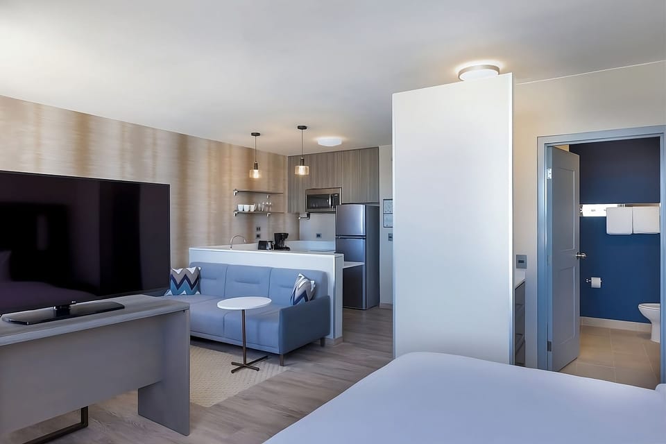 Relax on the sofa after cooking in your kitchenette nook.
