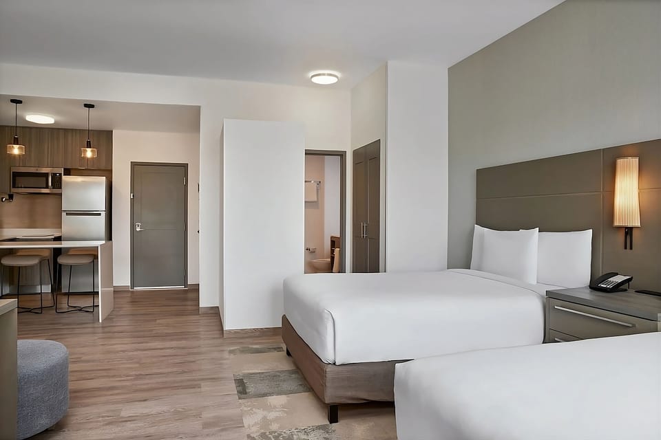 Unwind in a spacious studio with kitchenette and plush beds.