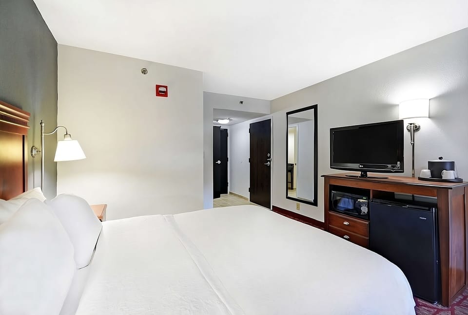 Refresh anytime with mini-fridge, coffee station, and entertainment.