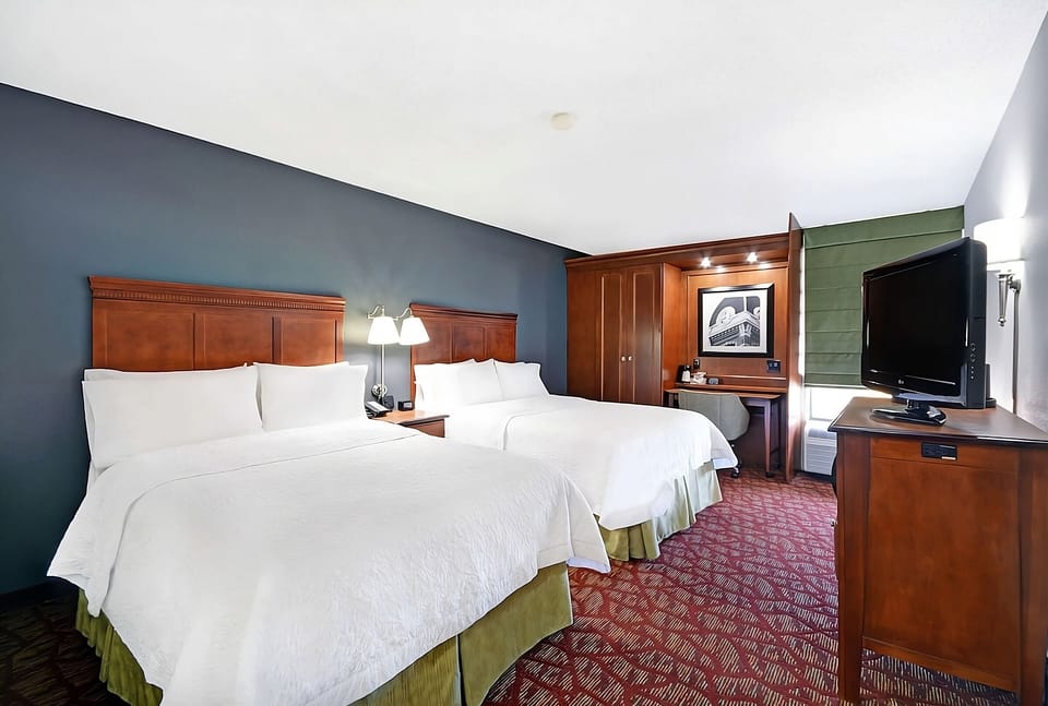 Settle in comfortably with two plush beds and warm lighting.