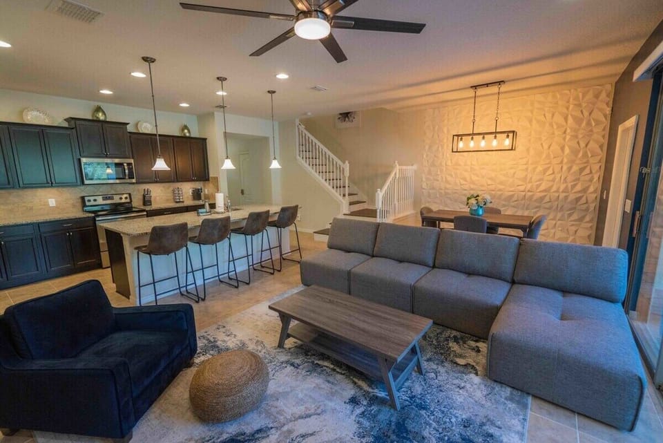Welcome to the heart of our home: a cozy downstairs family room seamlessly connected to a modern, fully-equipped kitchen and a stylish dining area. Our kitchen comes with everything necessary for your culinary adventures during your stay. As a special treat, enjoy complimentary coffee pods with our convenient Keurig machine, ensuring a delightful start to your day!