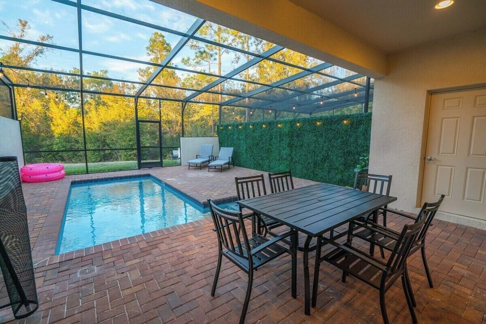 Check out our patio/private pool! Featuring a grass wall with tea lights and a private background of lush trees. Includes patio furniture, lounge chairs, floatable pool toys, and a child safety gate. 