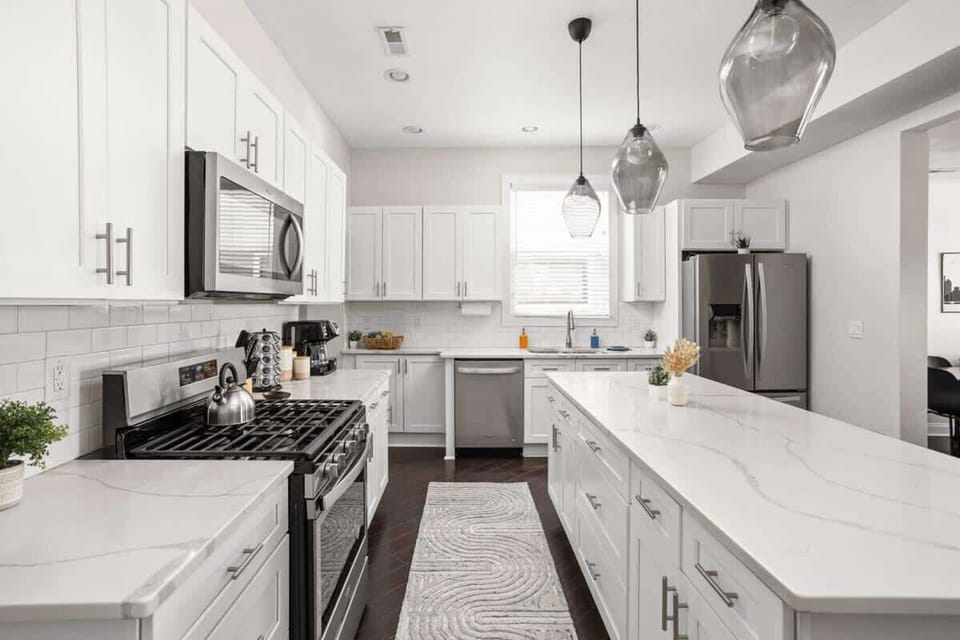 Step into our elegant, pristine kitchen, complete with a range of cooking utensils, modern appliances, and all the essentials you need for a seamless culinary experience.