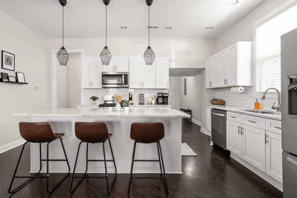 Our inviting kitchen, designed with a spacious countertop for both food preparation and dining. Perfect for hosting those family dinners!