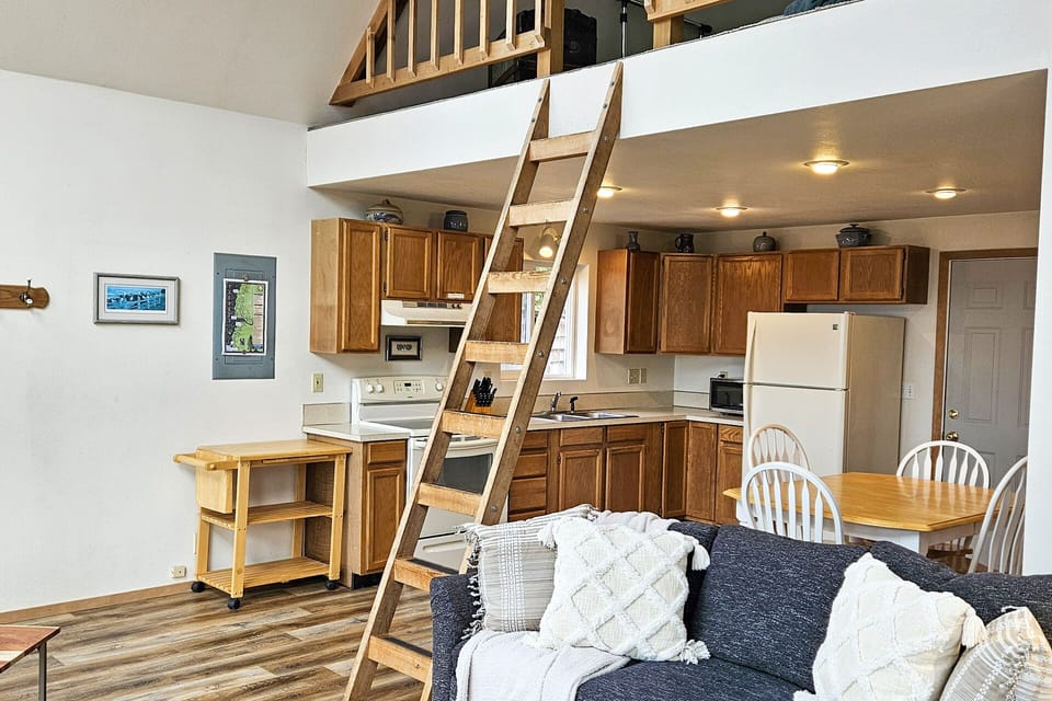 Open concept with ladder to the loft.