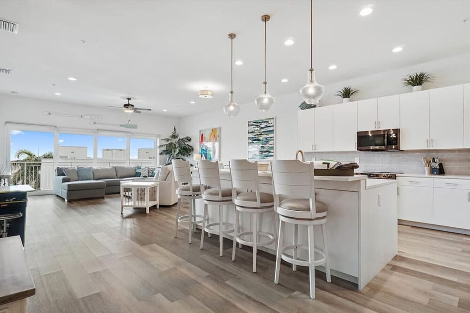 Open concept modern living area with kitchen