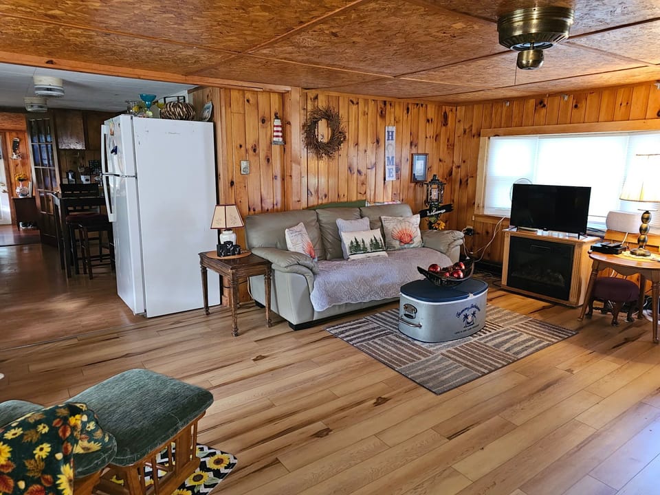 living room with roku tv bay window 