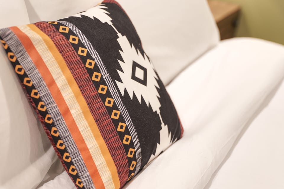 Crisp White linens, plump pillows and comforters