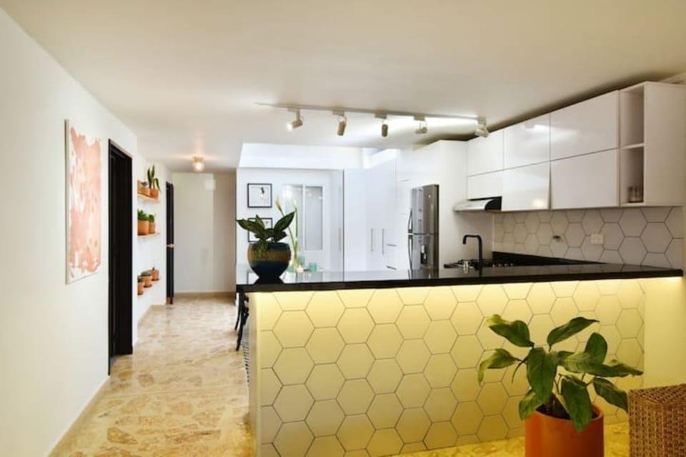 Marble kitchen countertop with gorgeous lighting fixtures.