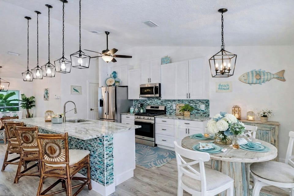kitchen & breakfast nook ,  overlooking the pool area and waterfall 