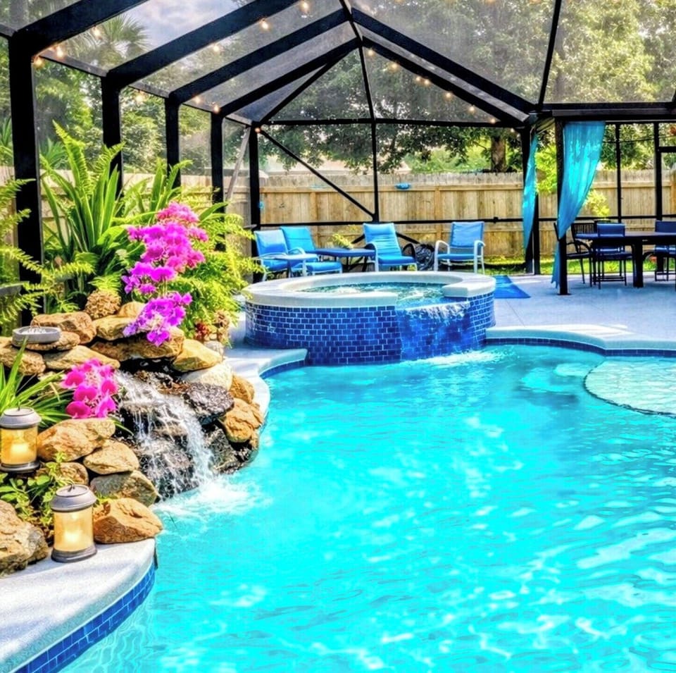 Hot tub ,resort-style waterfall, sparkling pool and Florida sunshine.