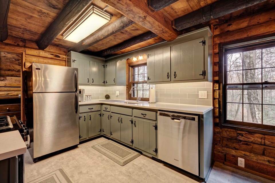 Fully-stocked kitchen with original solid wood cabinetry and Keurig cofee-maker