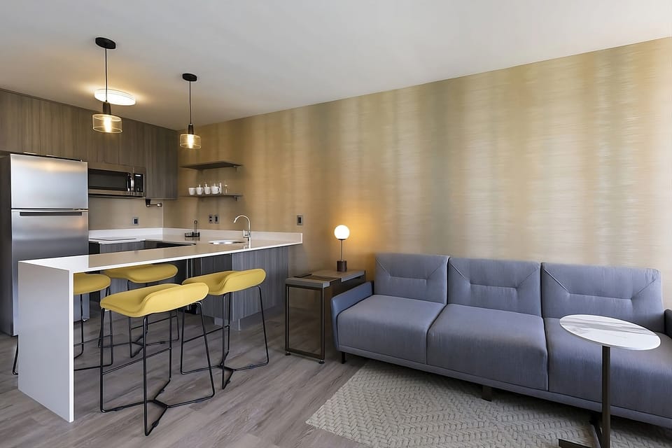 Lounge comfortably after adventures beside the stylish kitchenette.