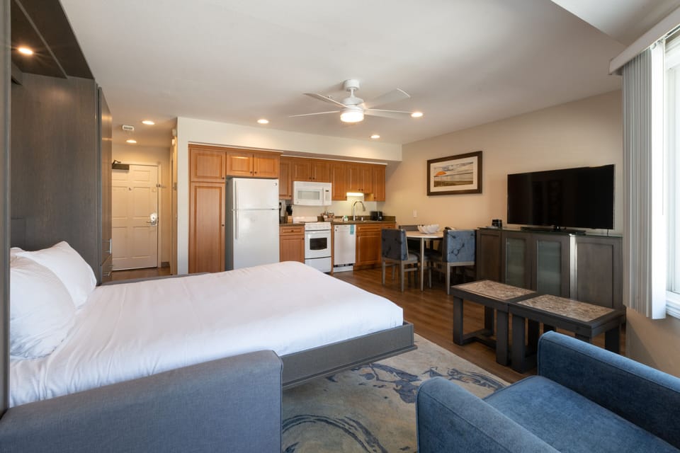 Unwind in the open studio with bed, kitchen, and TV.