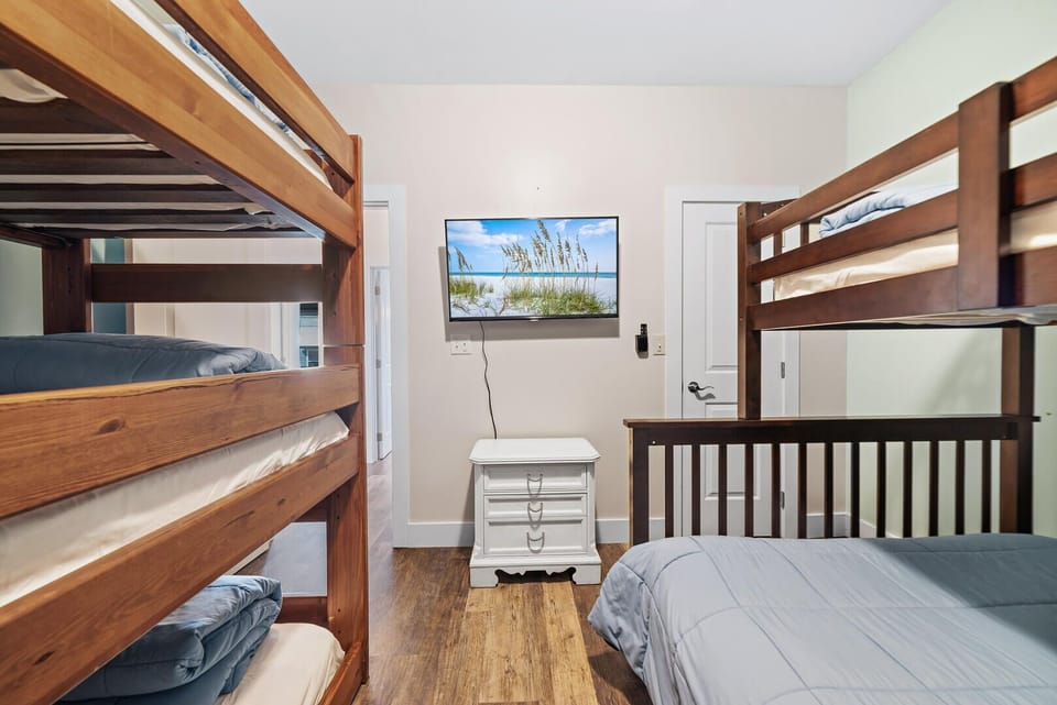 A cozy bunk room with Smart TV