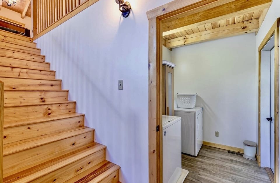 Laundry room, staircase leading up to the loft 
