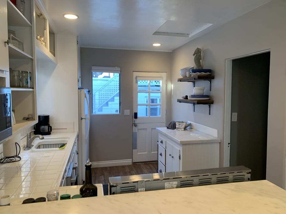 Charming Dutch door in kitchen for ocean breeze