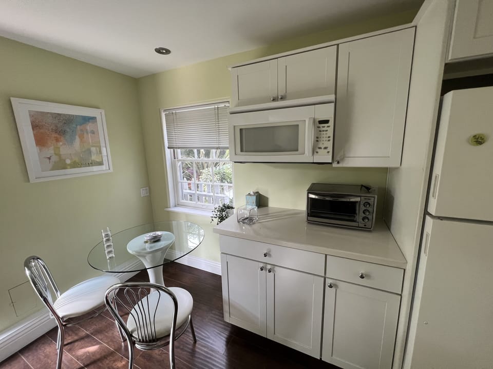 front door to the left, breakfast nook and kitchen