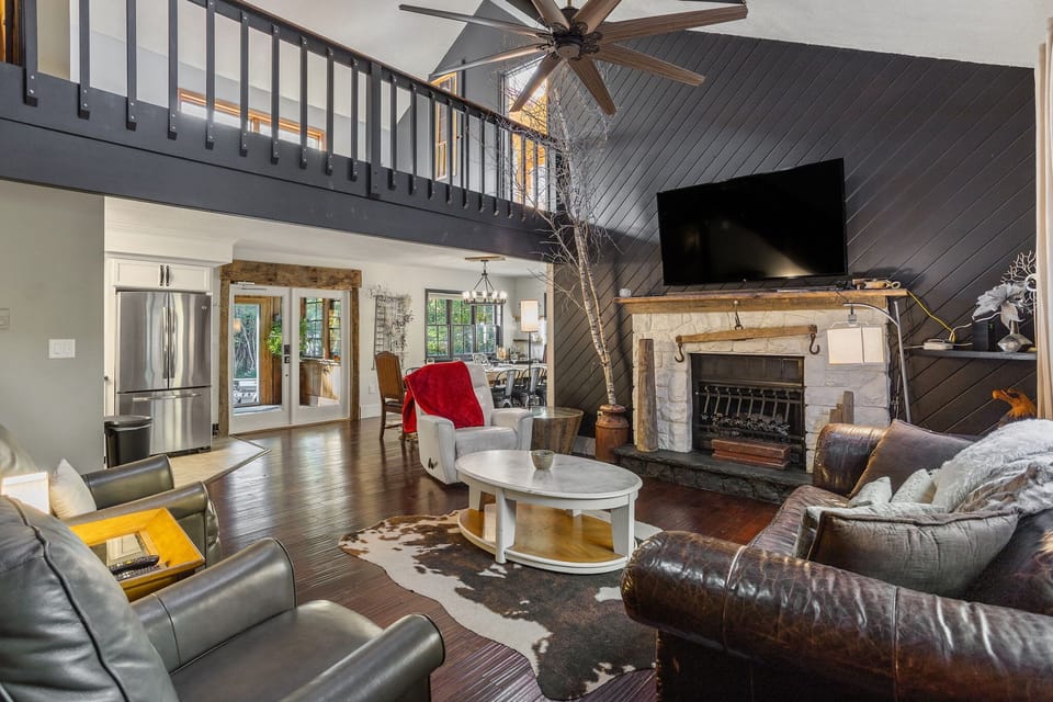 Spacious Living Room with Fireplace – Gather around the fireplace in this beautifully designed living space.