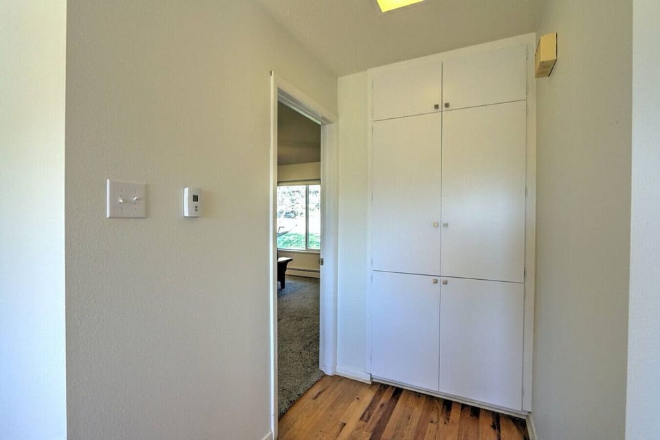 Walkway into master bedroom across from dining room