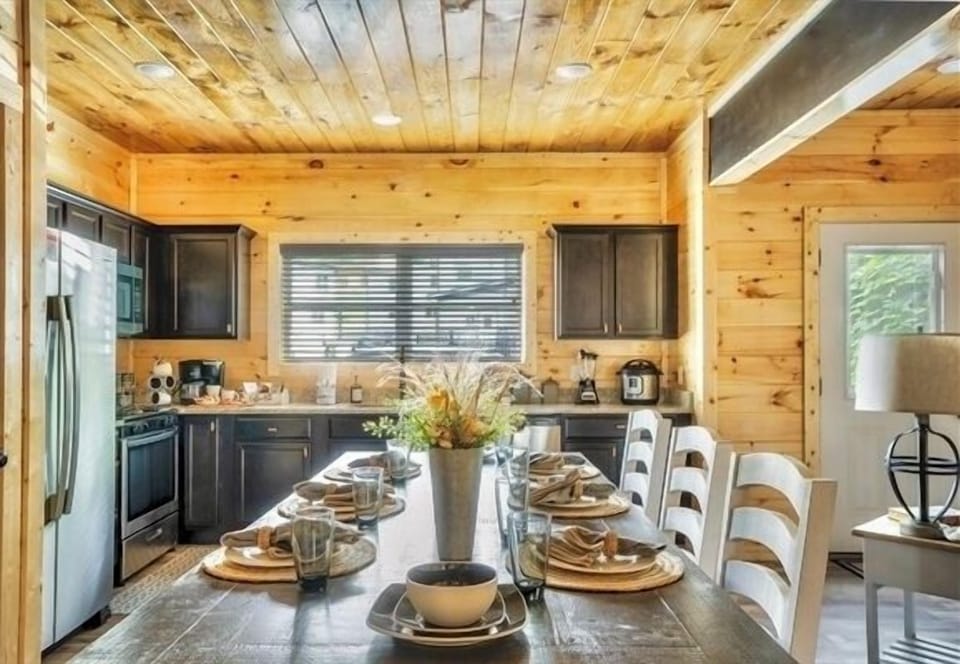 Fully equipped gourmet kitchen with a spacious range, dual-function coffee maker, and elegant decor, perfect for culinary enthusiasts.