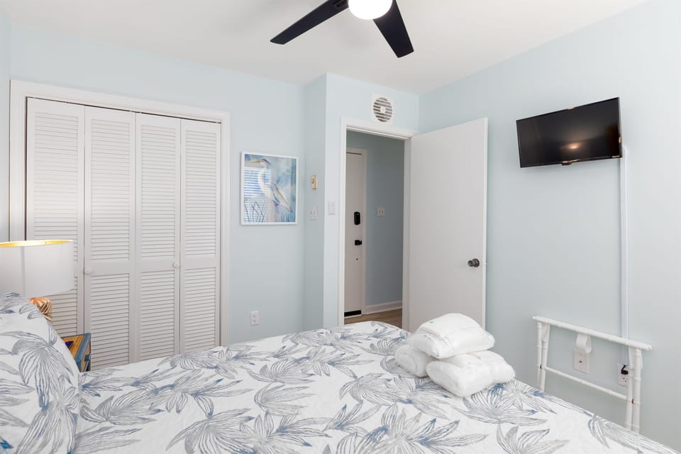 TV and luggage rack in bedroom