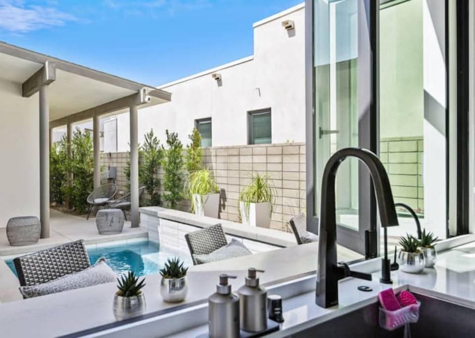 Pass through sliding kitchen window to pool patio
