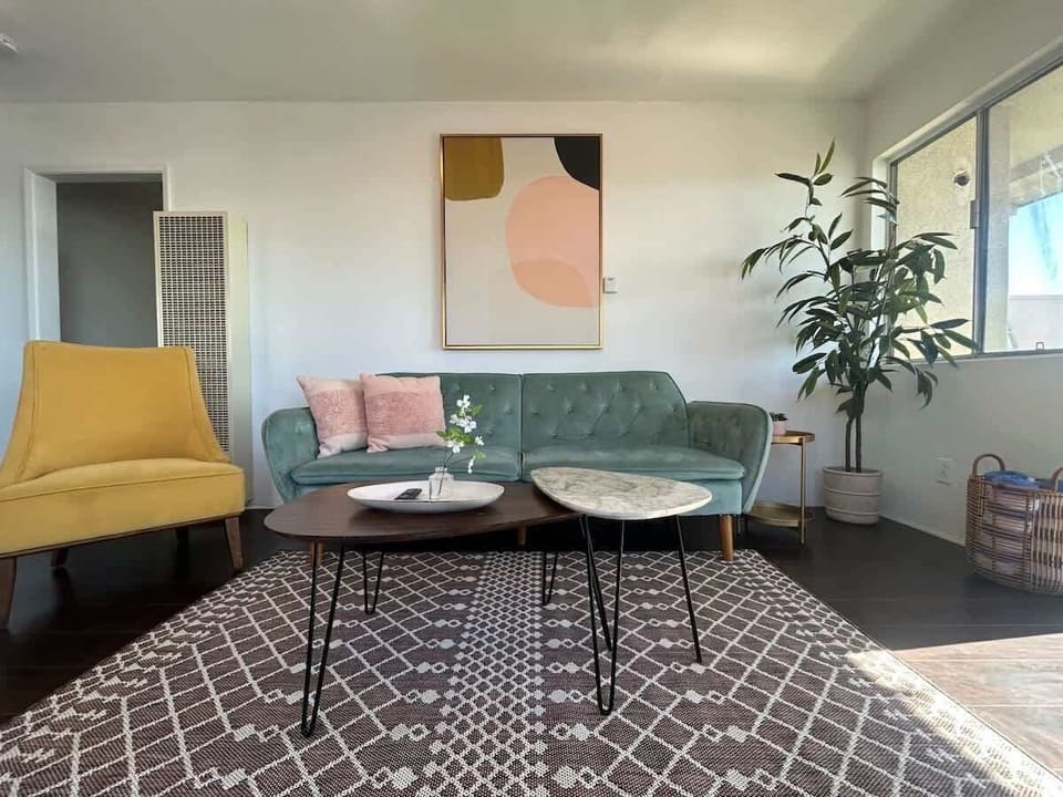 This modern and clean living room includes a comfortable seating options as well as a desk overlooking the beautiful Pacific Ocean.

