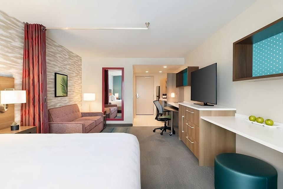 Unwind after adventures with sofa seating and spacious workstation.