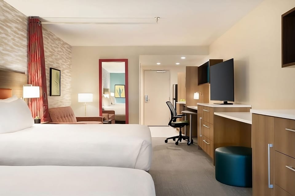 Settle in comfortably with two beds and a sleek desk.