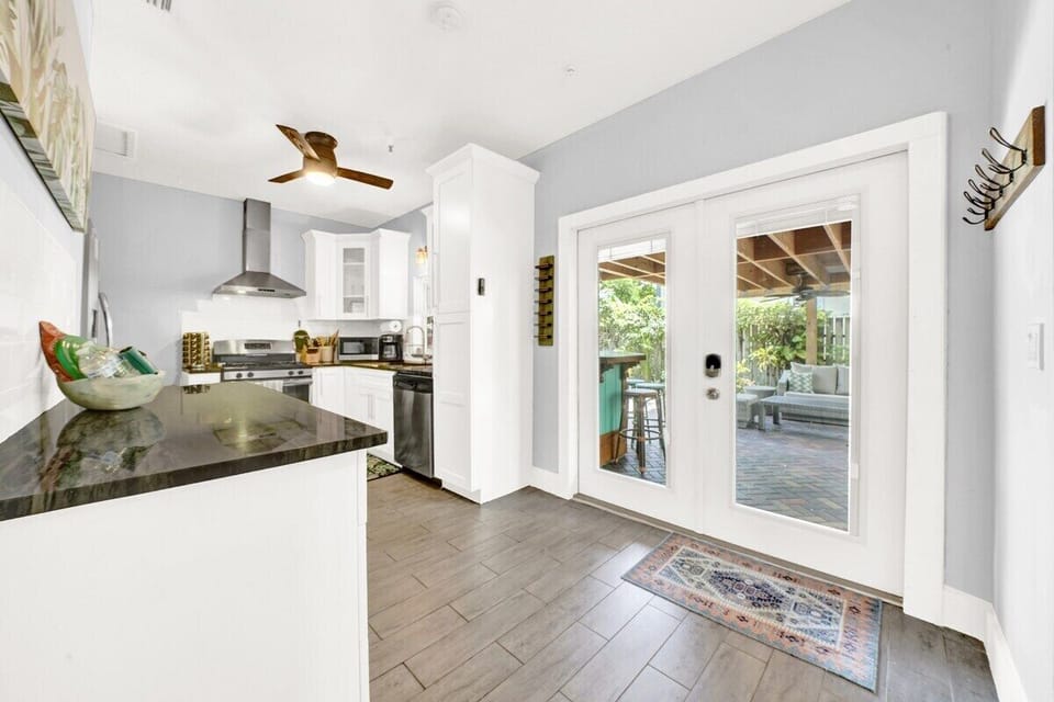 The Flora Cottage kitchen has all the cooking supplies and amenities you'll need to host your group.  Enjoy cooking meals in this well equipped kitchen.