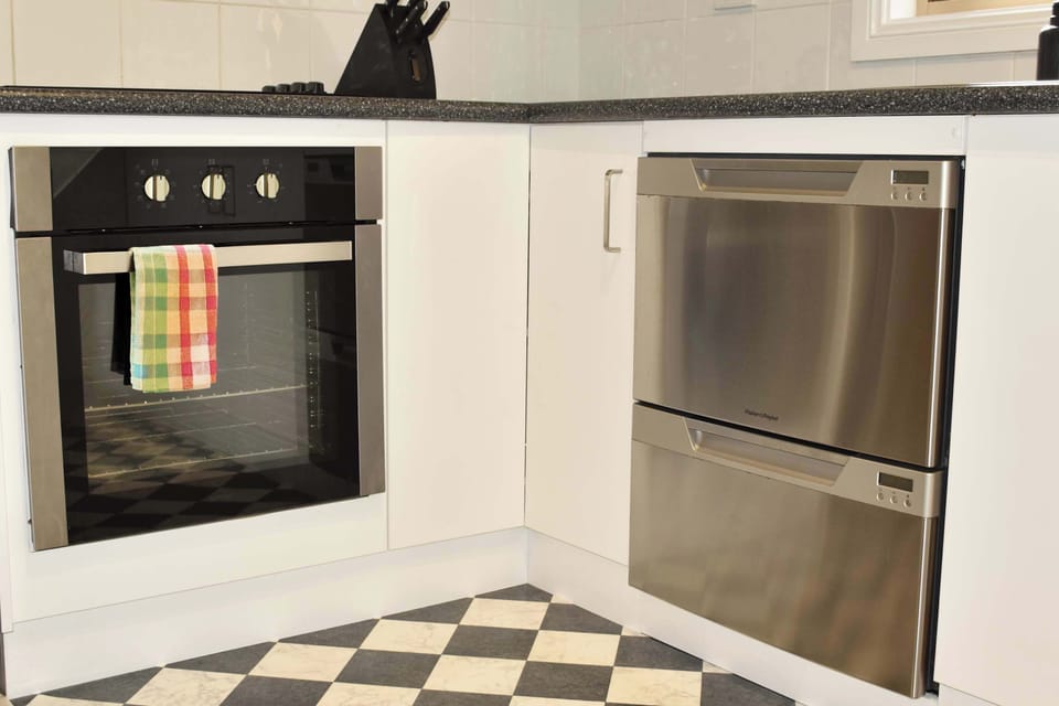 Electric Oven, cooktop, dishwasher and microwave.