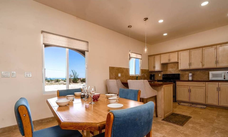 Gather around the dining table at Casa Desert Rose in El Dorado Ranch San Felipe Baja California Mexico — perfect for meals and games.
