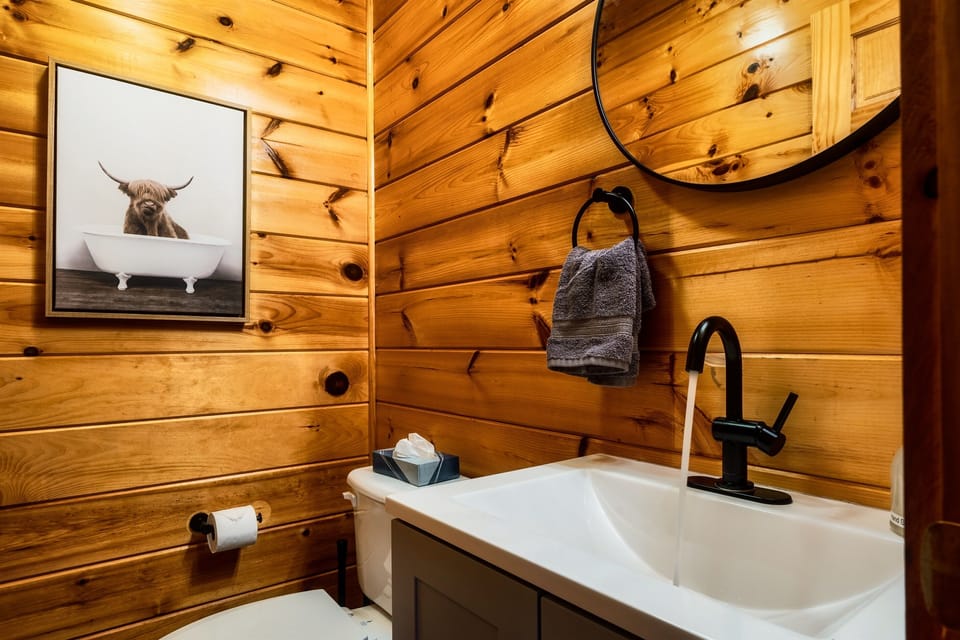 The main floor powder room is conveniently located near the family room and kitchen.