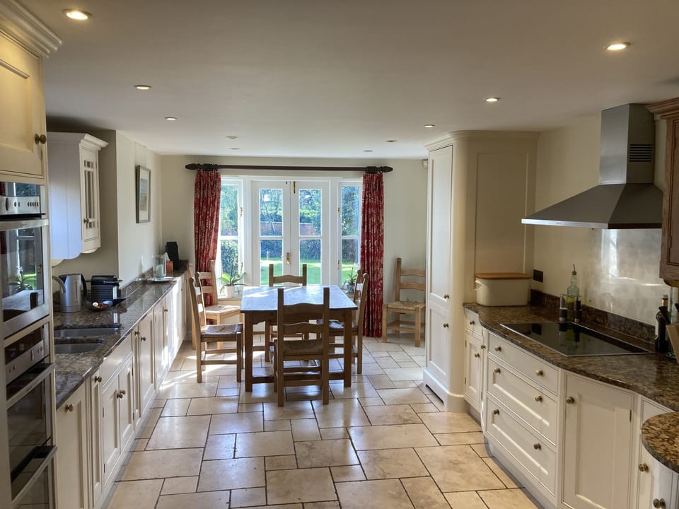 Kitchen with French Doors leading out into the rear garden
