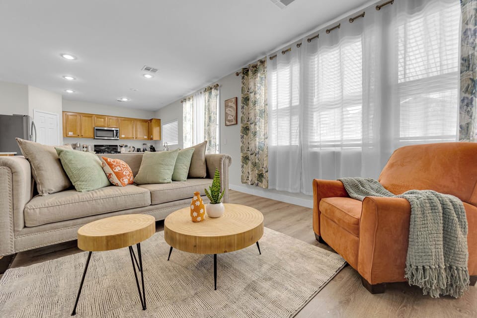 1st Floor family room with cozy sofa, chair & smart TV