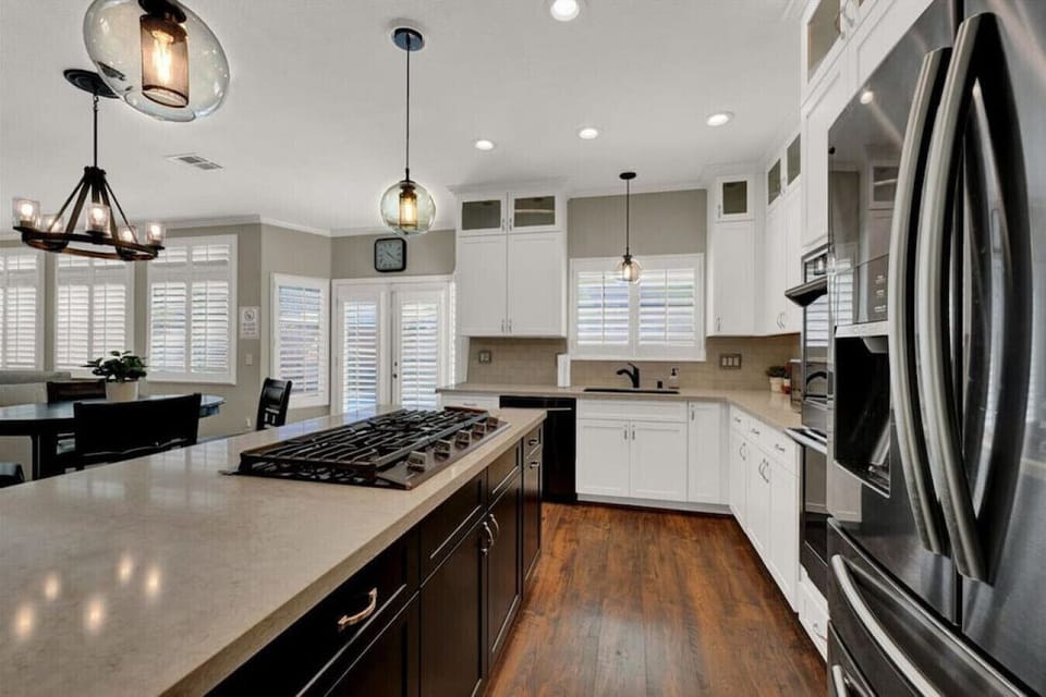 Experience culinary delight with a well-equipped kitchen, including quality appliances and a complete set of cookware.