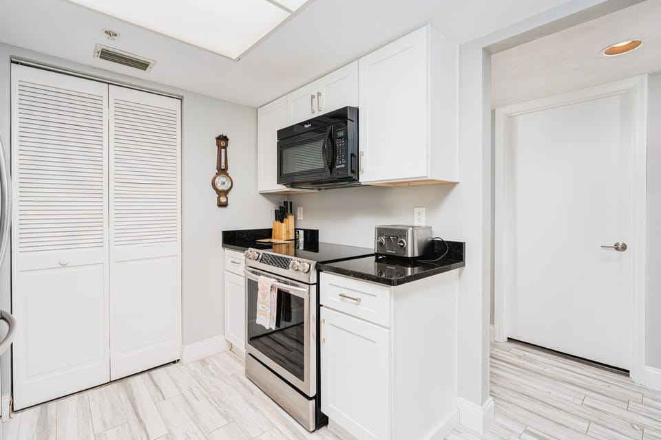 Laundry closet is behind the door on the left