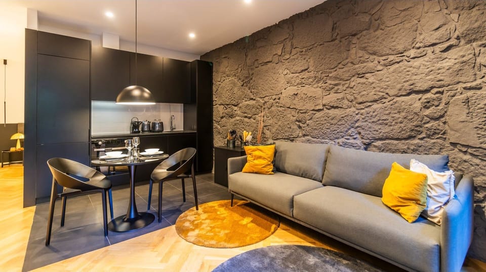 Full layout of the main area of the apartment: an open space that effortlessly connects the living room, the dining area and the kitchenette #contemporary #wonderful