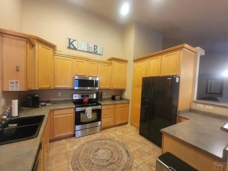 Kitchen with two types of coffee makers.
Drip style and Keurig.