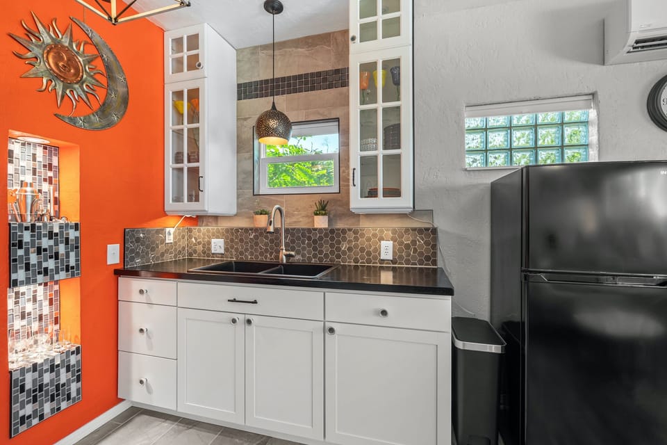 The kitchen has everything you need, including a bar area and stocked coffee/tea